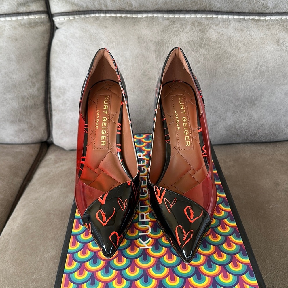 Pointed toe high heel 3.74” leather with heart accents. Only worn once
